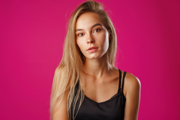Close up portrait of a nice young casual woman with long blonde hair
