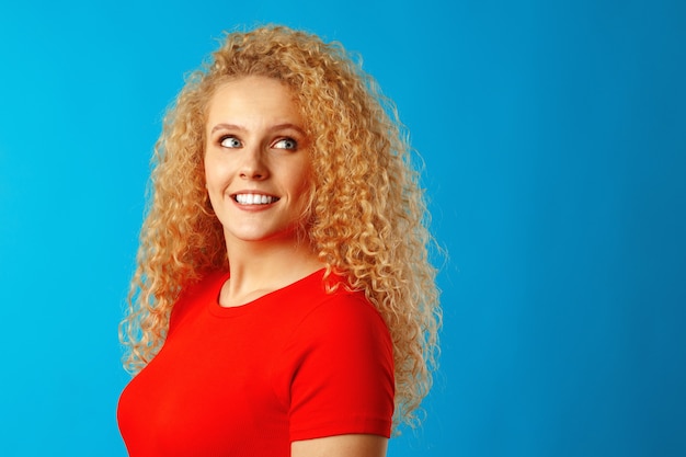 Close up portrait of a nice young woman with long curly hair