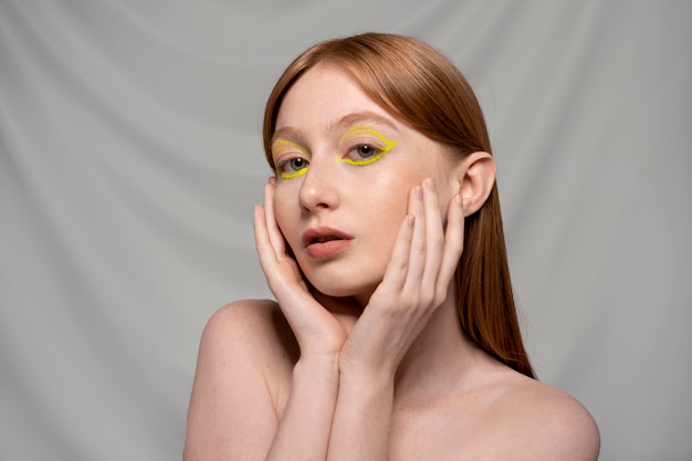 Close up portrait of person wearing make up liner