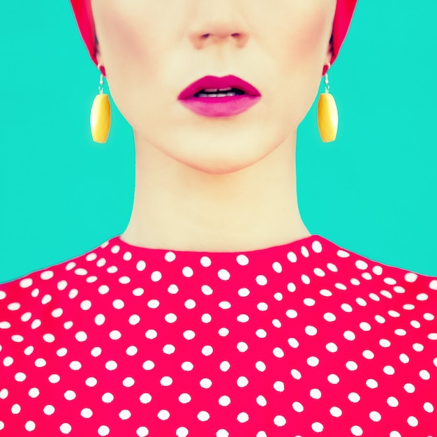 Close-up portrait of retro girl on the blue background