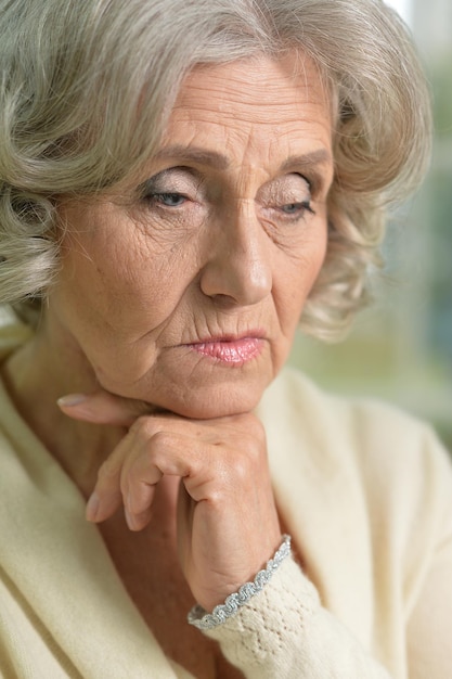 Close up portrait of sad senior woman