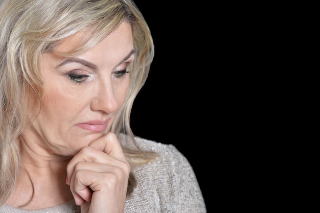 Close up portrait of a sad senior woman