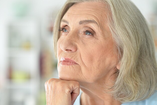 Close up portrait of sad senior woman