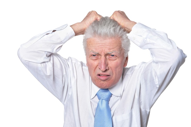 Close up portrait of senior businessman in formal wear posing