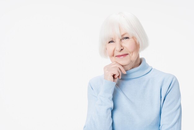 Close up portrait of senior caucasian woman isolated over white background