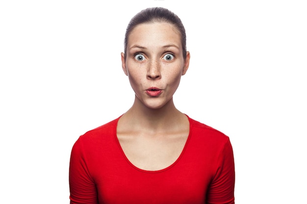 Close-up portrait of a serious young woman over white background