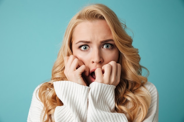 Close up portrait of a shocked young blonde woman