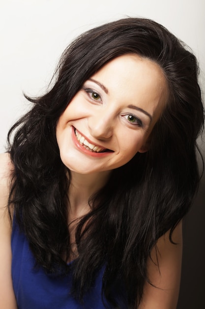 Close up portrait smiling brunette, studio shot