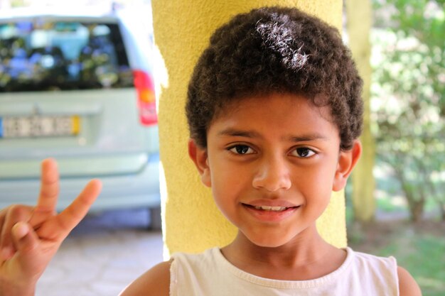 Close-up portrait of smiling cute boy