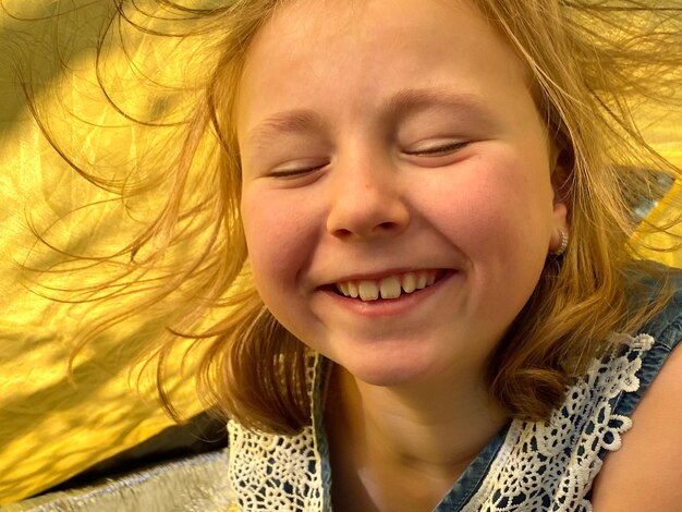 Close-up portrait of smiling girl