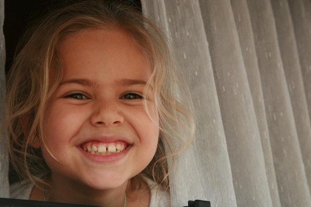 Close-up portrait of a smiling girl