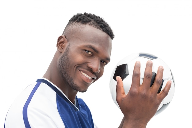 Close up portrait of a smiling handsome football player