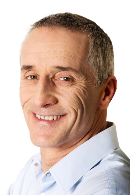 Close-up portrait of smiling man against white background
