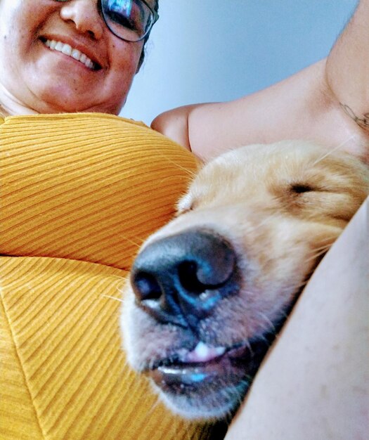 Close-up portrait of smiling woman with dog