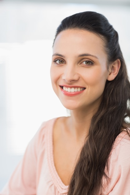 Close-up portrait of a smiling young businesswoman