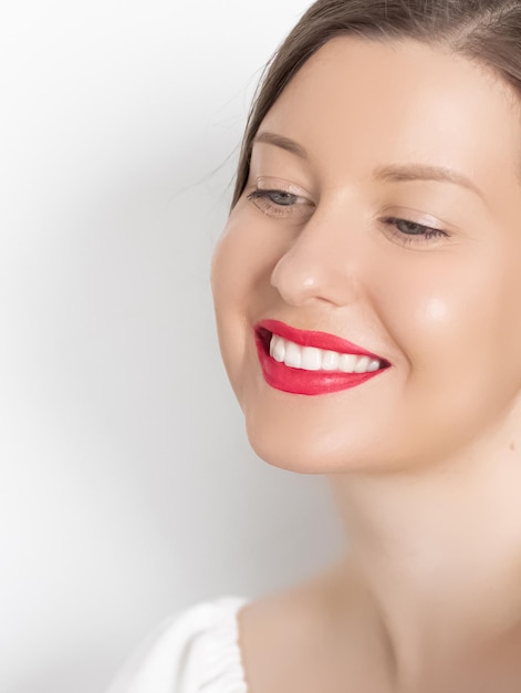 Close-up portrait of a smiling young woman
