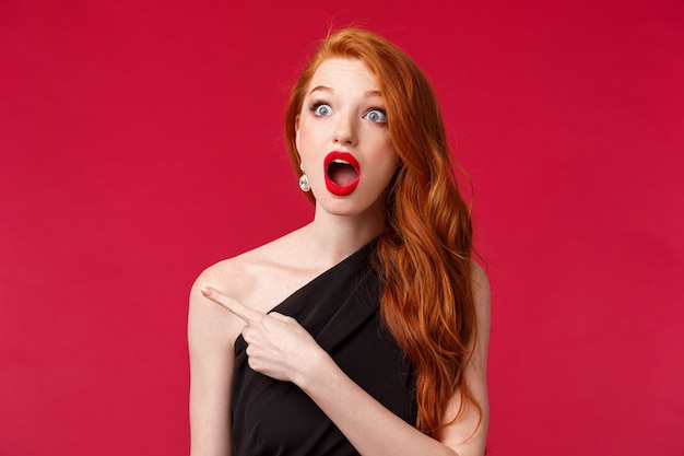 Close-up portrait of speechless impressed redhead woman drop jaw in amazement