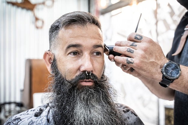 Close up portrait of a stylish client on a barber shop