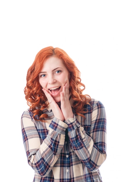 Close-up portrait of surprised beautiful girl. Over white background.