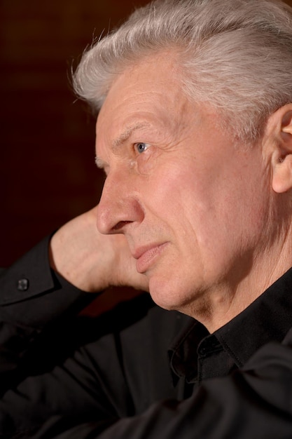 Close up portrait of thoughtful senior man