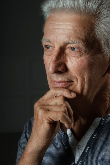 Close up portrait of thoughtful senior man