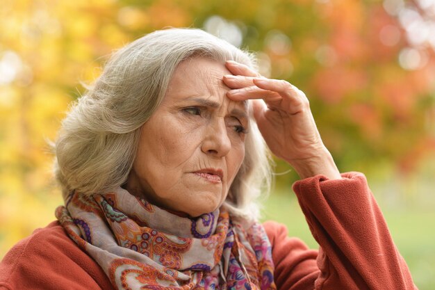 Close up portrait of thoughtful senior woman