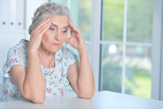 Close up portrait of tired senior woman