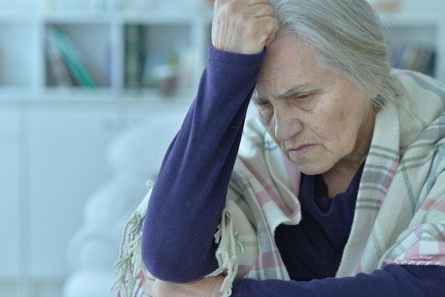 Close up portrait of tired senior woman