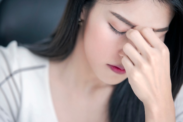 Close up portrait of upset or tired beautiful woman