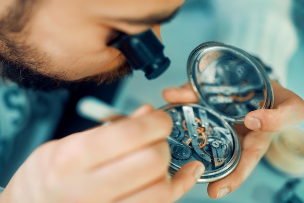 Close up portrait of a watchmaker at work