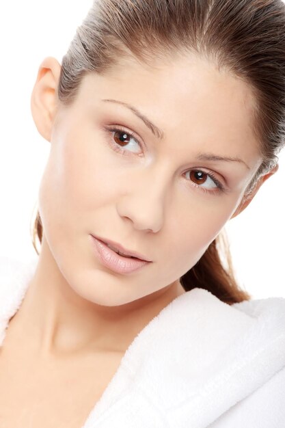 Close-up portrait of woman against white background