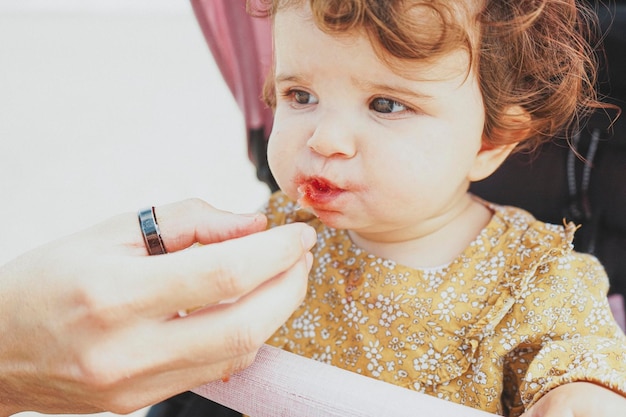 Close-up portrait of woman eating food