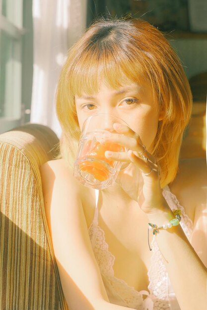 Close-up portrait of woman eating fruit