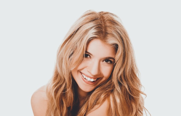 close-up portrait of woman smiling against white background