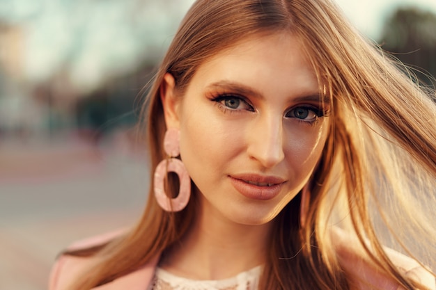 Close up portrait of a woman walking in the street