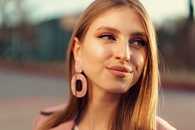 Close up portrait of a woman walking in the street