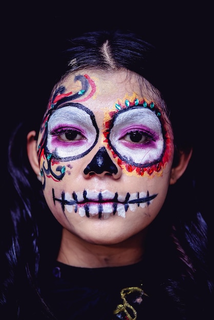 Close-up portrait of woman wearing mask