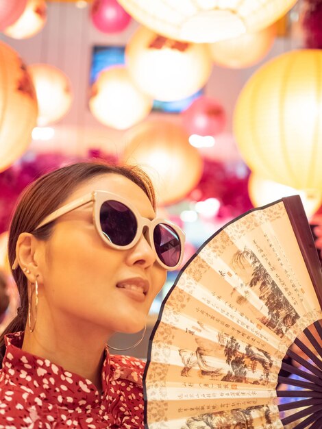 Close-up portrait of a woman wearing sunglasses