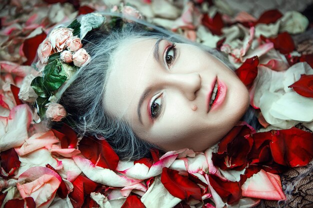 Close up portrait of a woman with roses