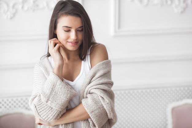 Close up portrait of young attractive woman indoors. Beautiful lady