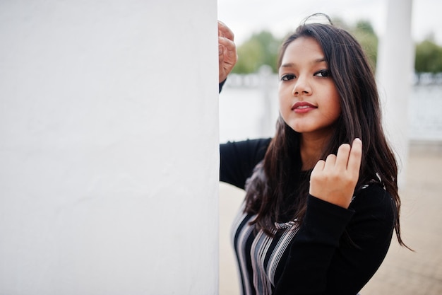 Close up portrait of young beautiful indian or south asian teenage girl in dress