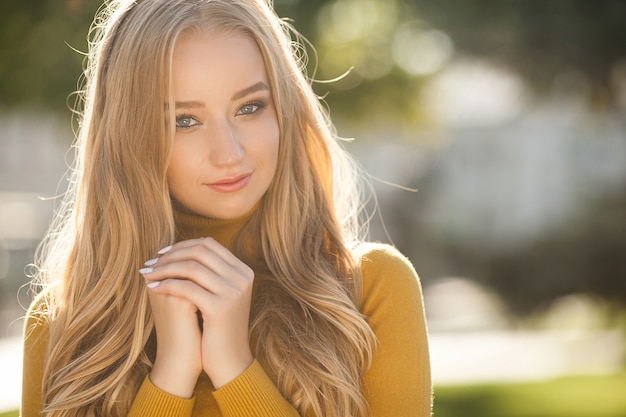 Close up portrait of young beautiful woman outdoors