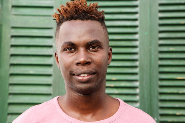 Close up portrait of young black man staring