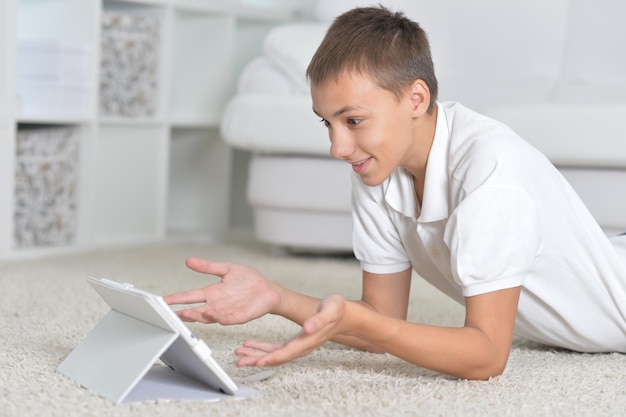 Close-up portrait of a young boy with the tablet