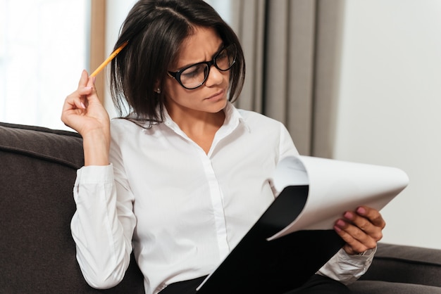 Close up portrait of a young business woman making notes