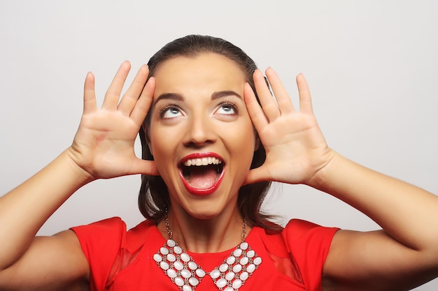 Close up portrait young happy woman in red dress