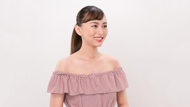 Close up portrait of young happy woman on white background