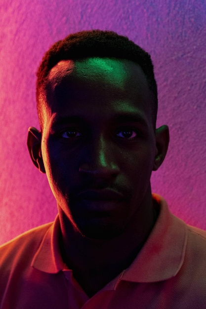 Close-up portrait of young man against wall