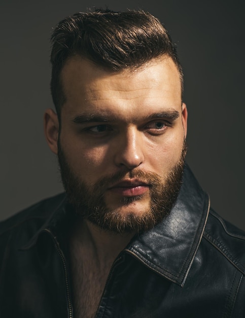 Close up portrait of young man. Handsome guy face. Fashion male model.