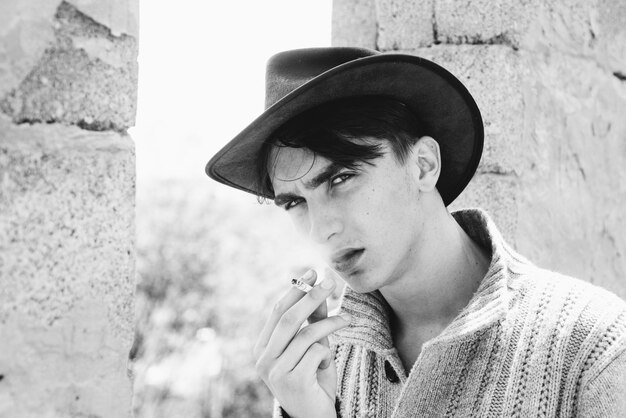 Close up portrait of young man Handsome guy with cowboy hat